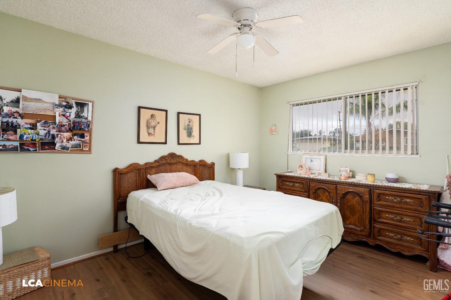 Undisclosed Address Bakersfield, CA 93306 - Photo 21 of 27 a bedroom with a bed and a dresser