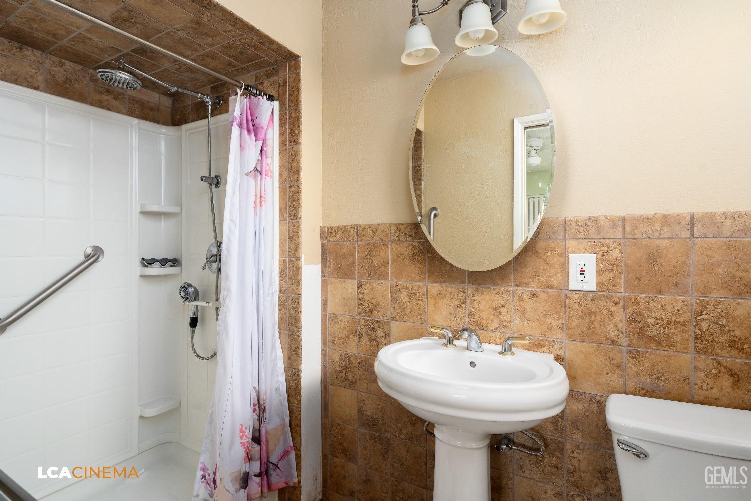 Undisclosed Address Bakersfield, CA 93306 - Photo 23 of 27 a bathroom with a sink toilet and shower
