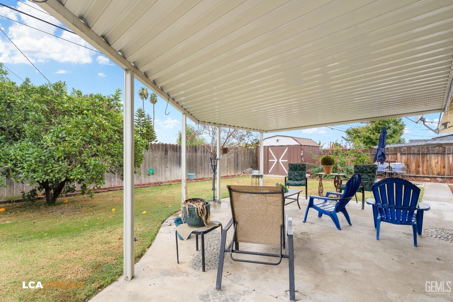 Undisclosed Address Bakersfield, CA 93306 - Photo 26 of 27 a patio with glass top table and chairs