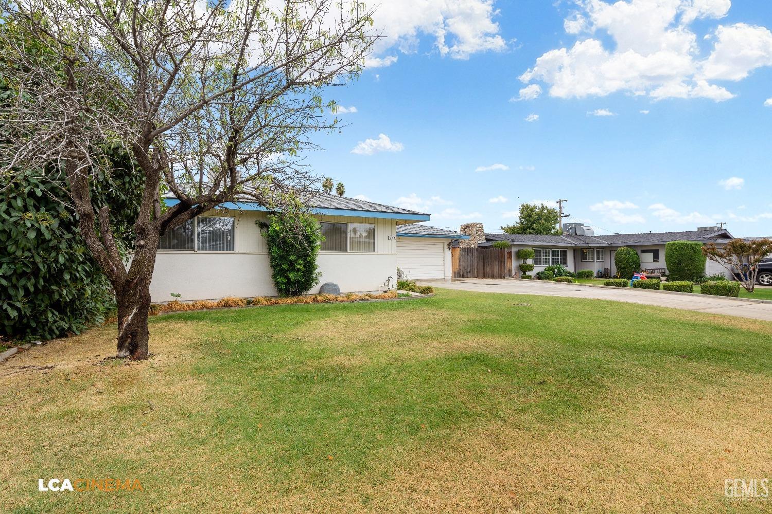 Undisclosed Address Bakersfield, CA 93306 - Photo 3 of 27 a front view of a house with garden