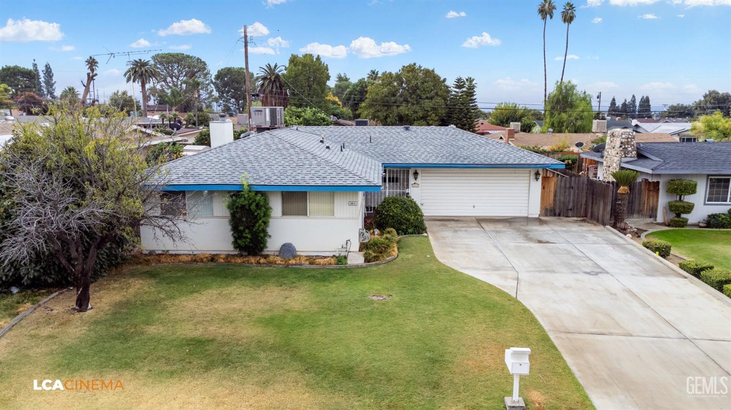 Undisclosed Address Bakersfield, CA 93306 - Photo 5 of 27 a view of a house with pool and a yard