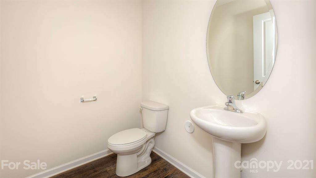 328 Gaines Road Clover, SC 29710 - Photo 15 of 34 a bathroom with a toilet sink and mirror
