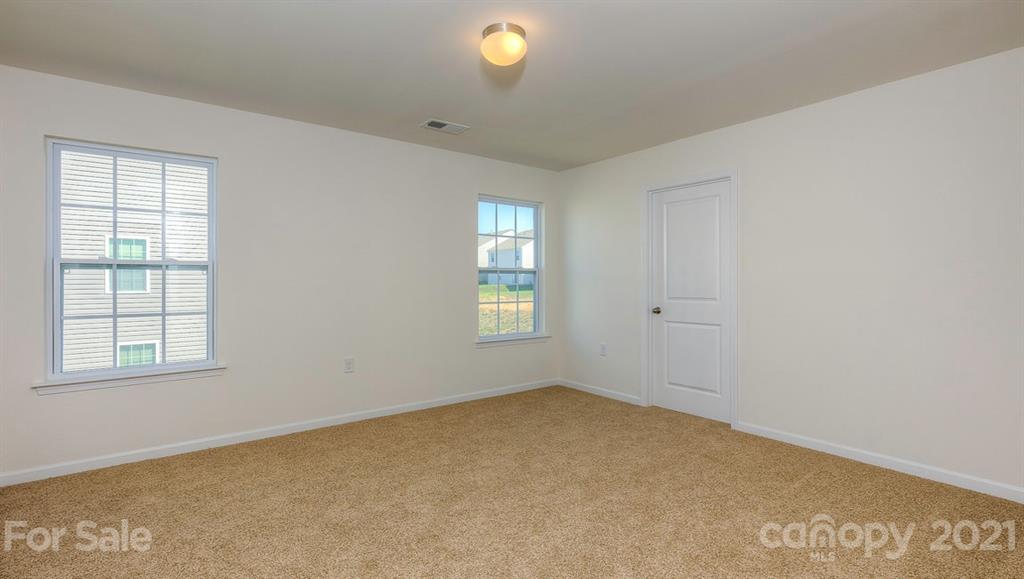 328 Gaines Road Clover, SC 29710 - Photo 18 of 34 an empty room with windows and closet
