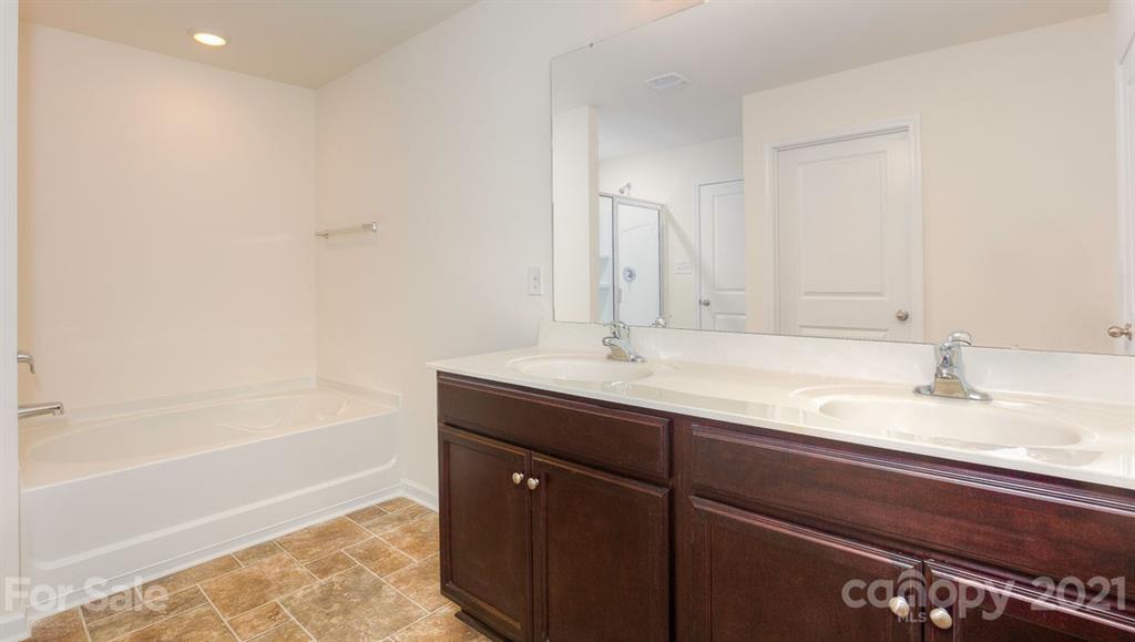 328 Gaines Road Clover, SC 29710 - Photo 21 of 34 a bathroom with a sink and a bathtub