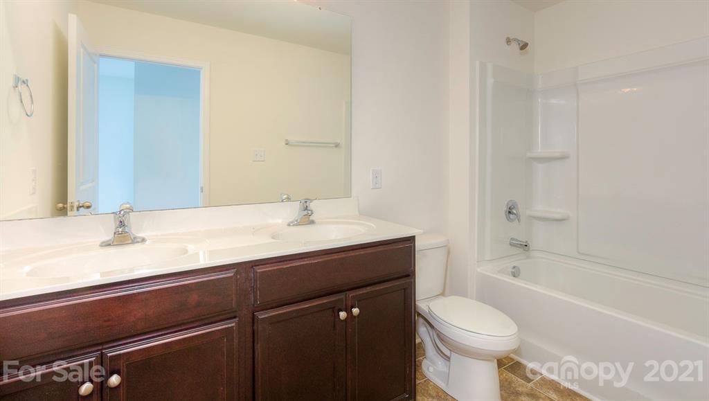 328 Gaines Road Clover, SC 29710 - Photo 28 of 34 a bathroom with a granite countertop sink toilet and shower