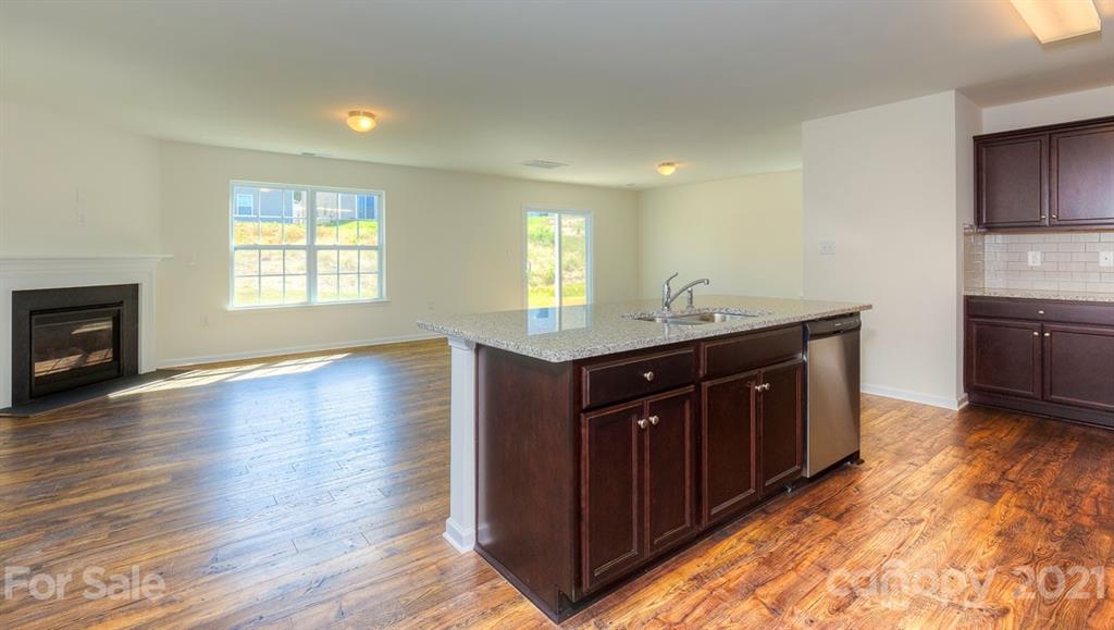 328 Gaines Road Clover, SC 29710 - Photo 7 of 34 a kitchen with granite countertop a sink and a stove top oven