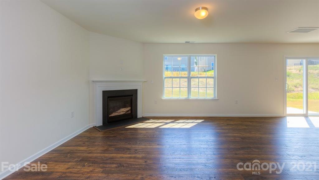 328 Gaines Road Clover, SC 29710 - Photo 10 of 34 a view of an empty room with wooden floor and a window
