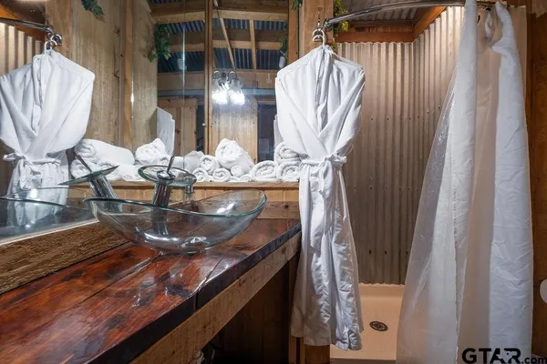 a view of living room with furniture and a chandelier