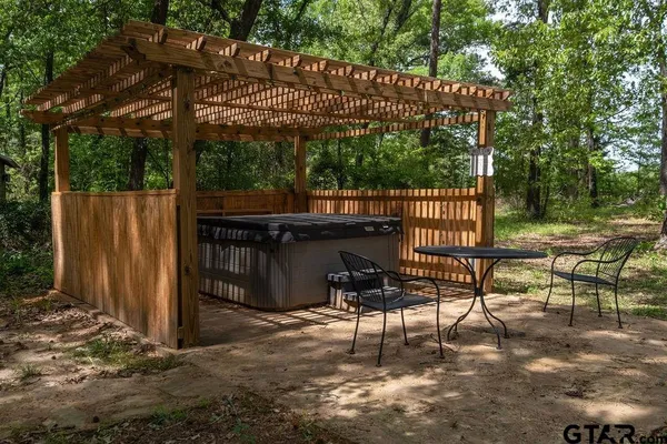 a view of a chairs and table in the patio