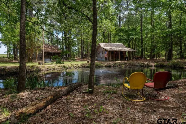 a backyard of a house with yard barbeque oven and outdoor seating