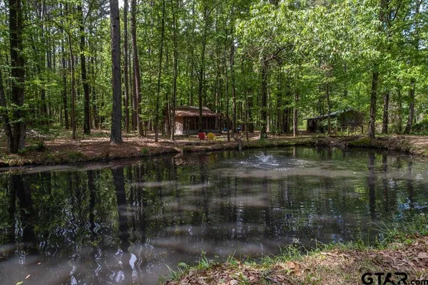 a view of swimming pool with a yard