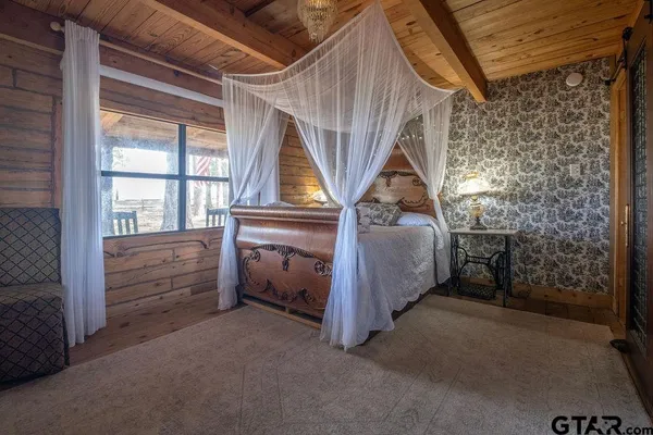 a bed room with a bed and a window