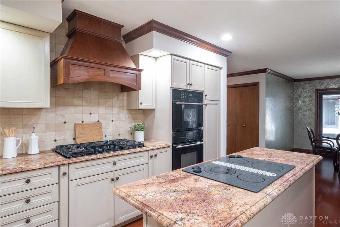 273 North Alpha Bellbrook Road Dayton, OH 45434 - Photo 16 of 43 This spacious kitchen offers ample countertop space, modern appliances, and elegant wood cabinetry.