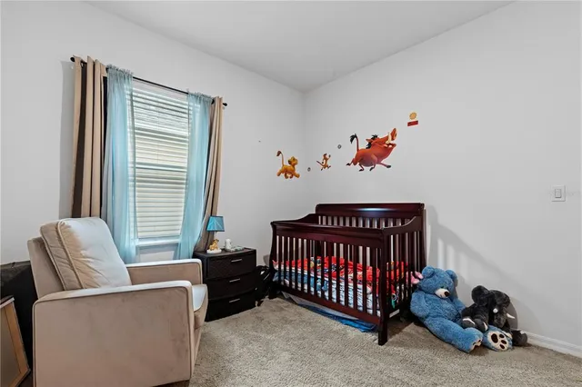 a bedroom with furniture and a window