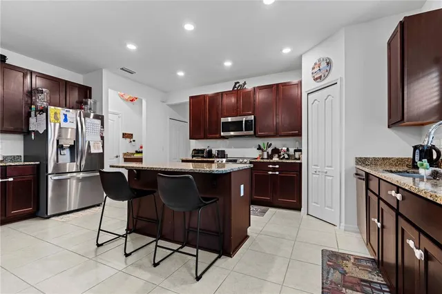 a kitchen with a sink cabinets and stainless steel appliances