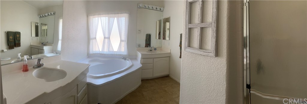 12600 Havasu Lake Road, Unit 94 Needles, CA 92363 - Photo 17 of 39 Master full bathroom, 2 sink/vanities, stall shower and soaker tub