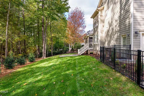 a view of a garden with a house