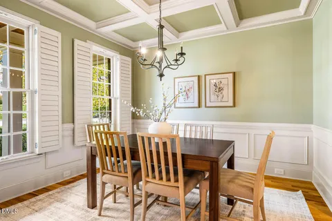 a view of a dining room with furniture and window