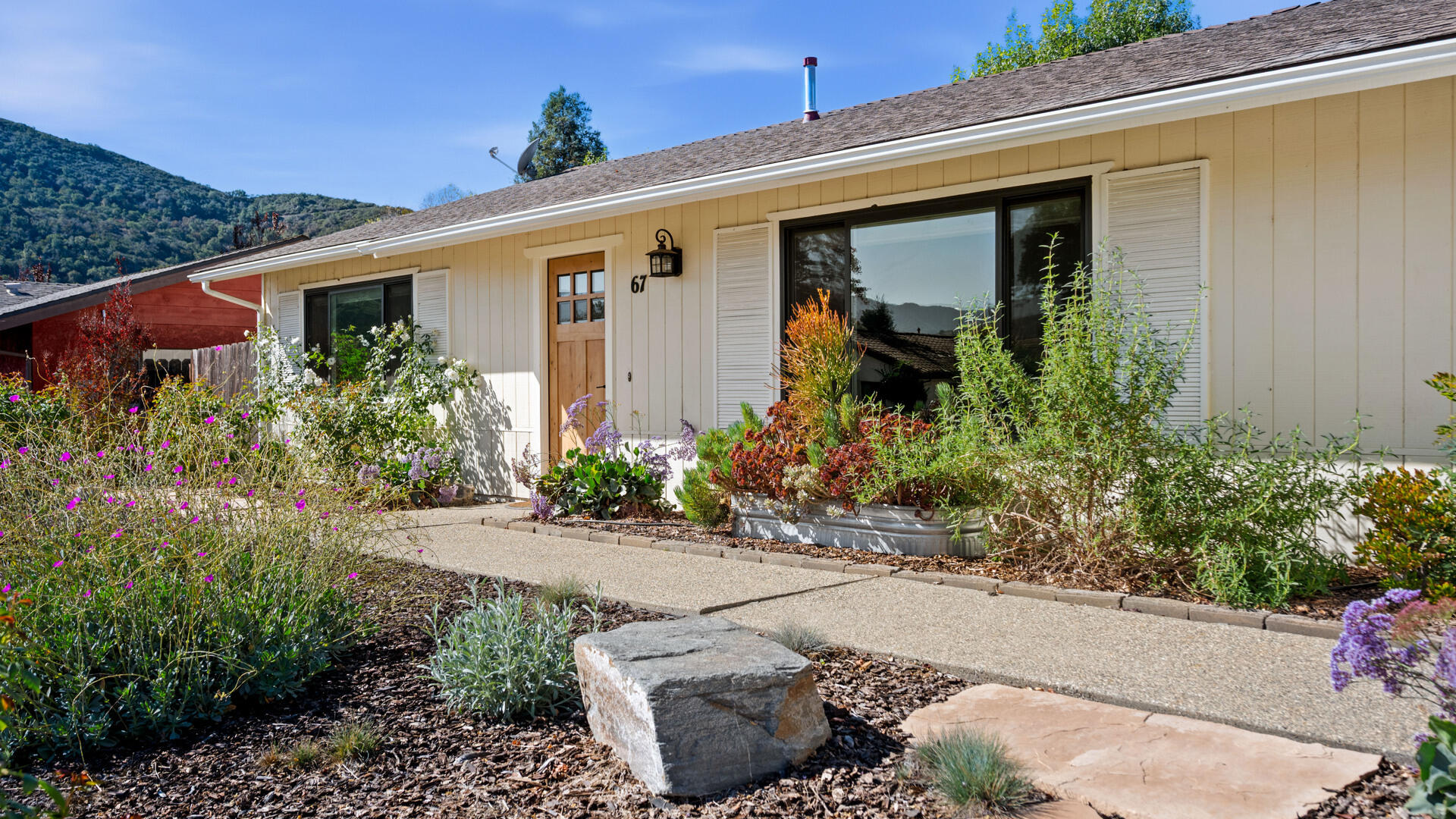 a front view of a house with garden