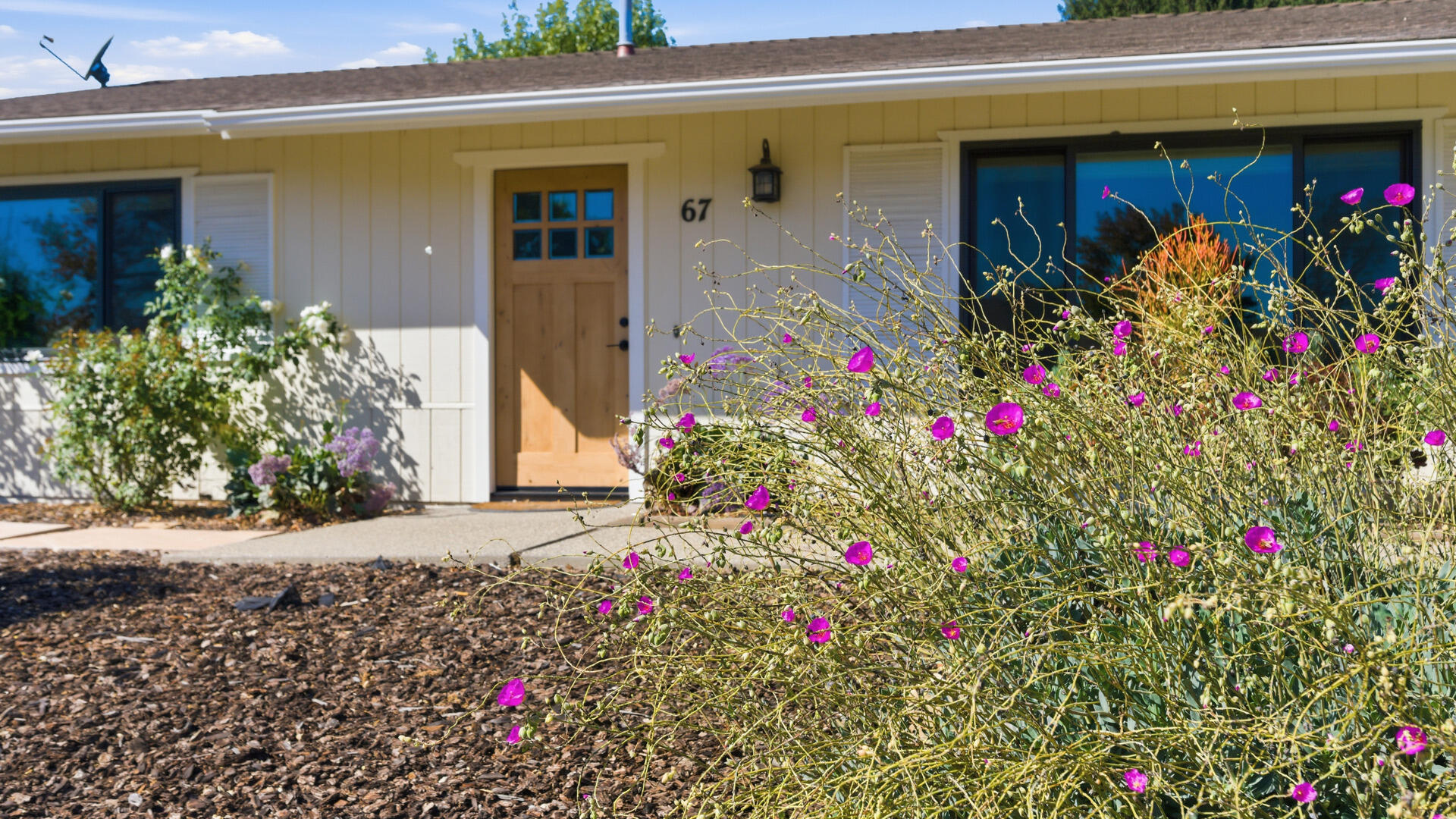 67 Pepperwood Way Solvang, CA 93463 - Photo 2 of 25 a front view of house with flower around