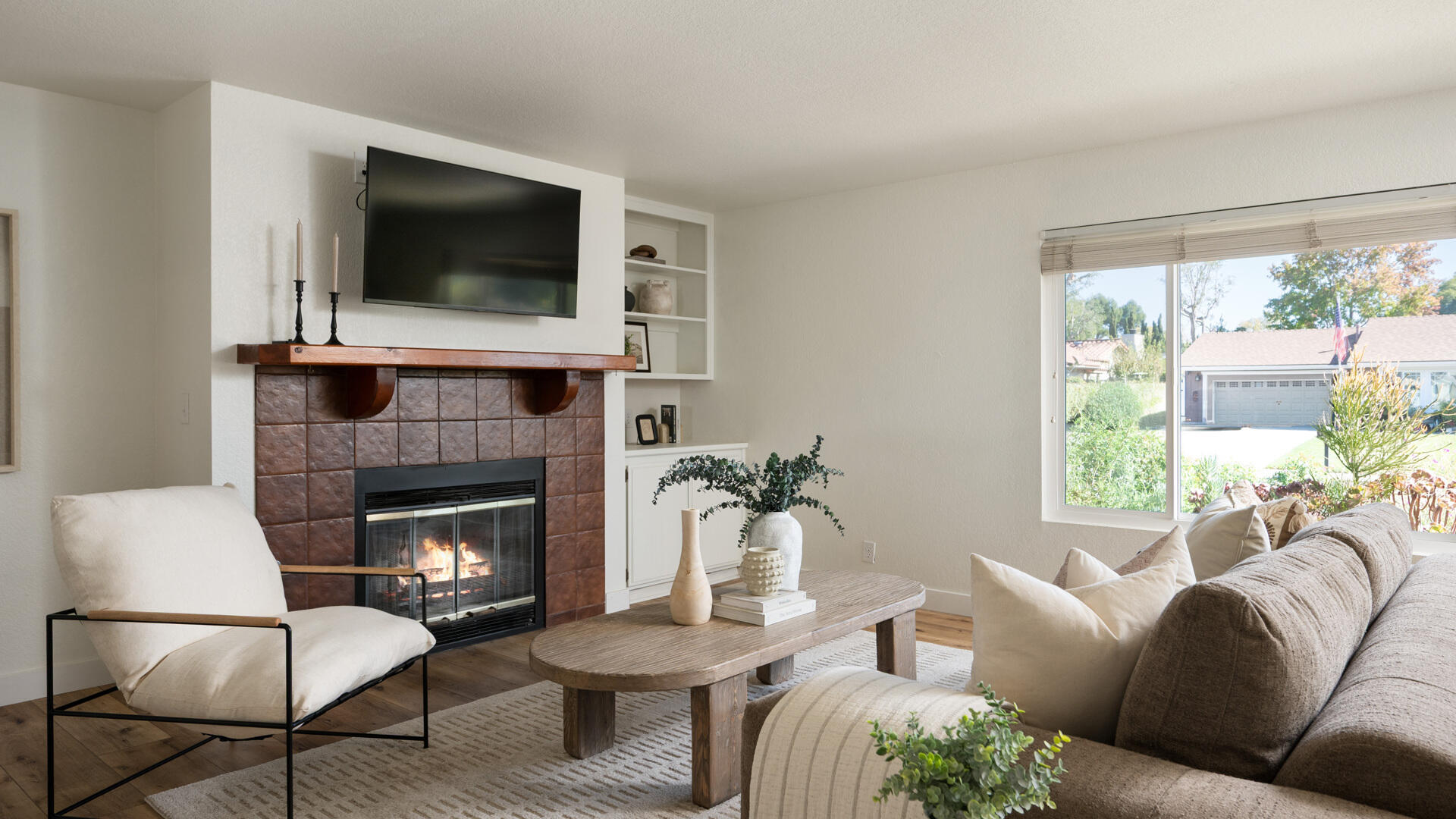 67 Pepperwood Way Solvang, CA 93463 - Photo 3 of 25 a living room with furniture a flat screen tv and a fireplace