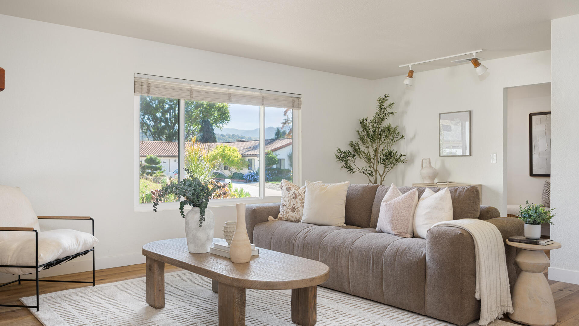 67 Pepperwood Way Solvang, CA 93463 - Photo 4 of 25 a living room with furniture and a potted plant