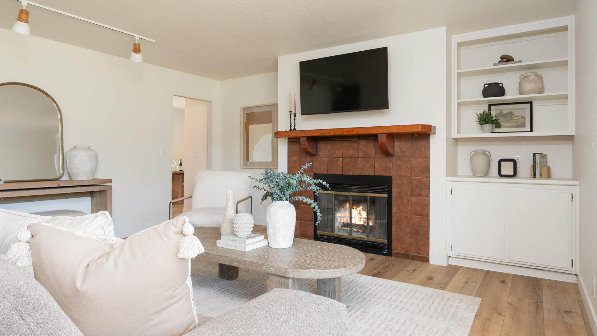 67 Pepperwood Way Solvang, CA 93463 - Photo 5 of 25 a living room with furniture a flat screen tv and a fireplace
