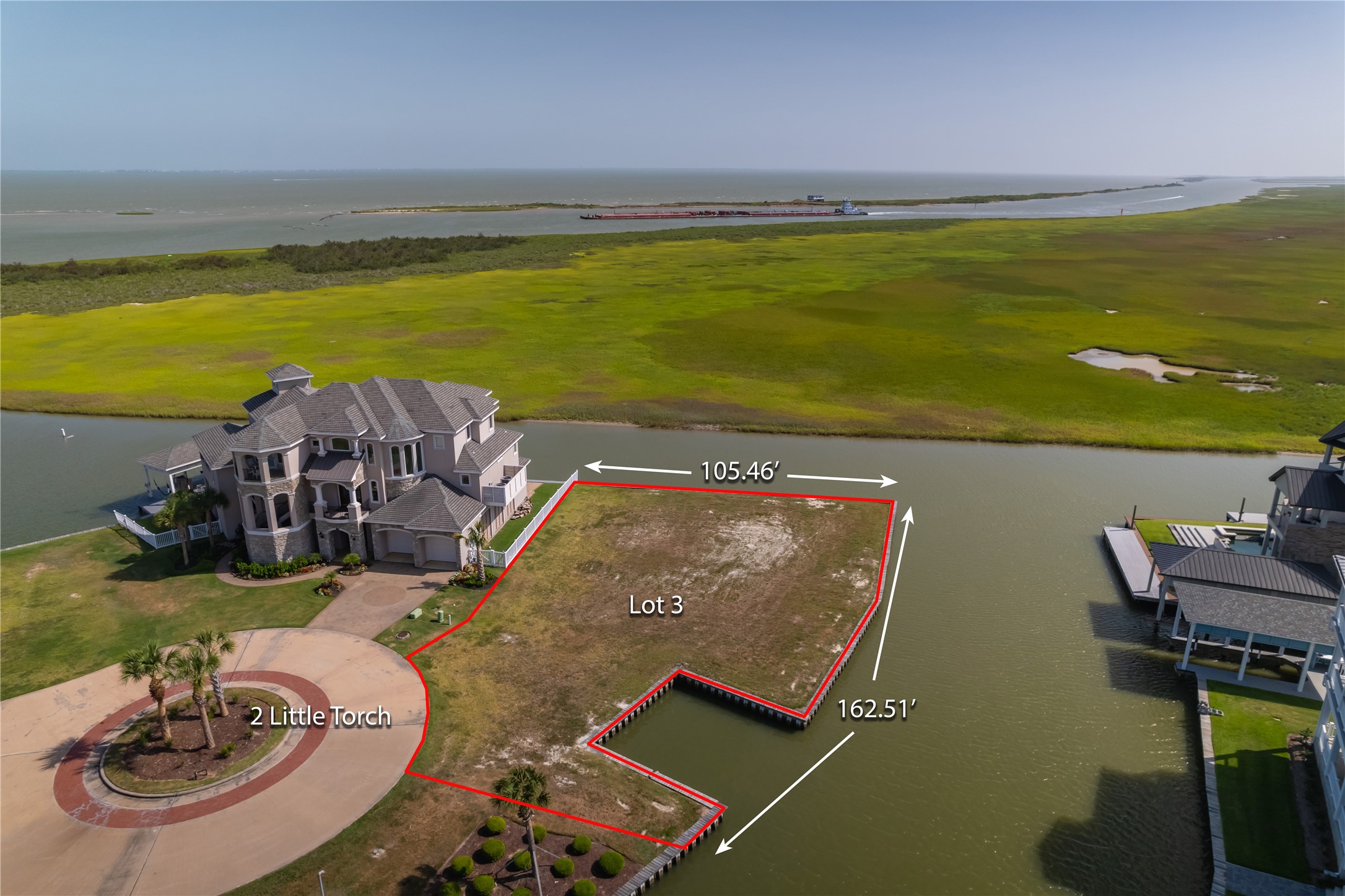 a view of a swimming pool with an ocean view