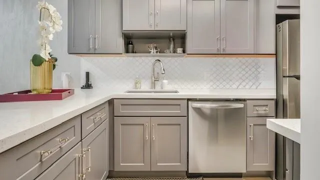 a kitchen with cabinets appliances and a counter top