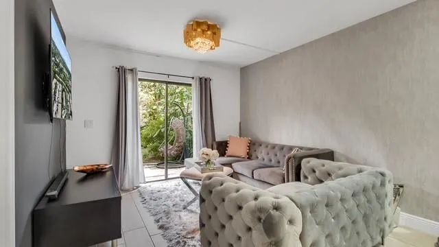 a bedroom with furniture and a window