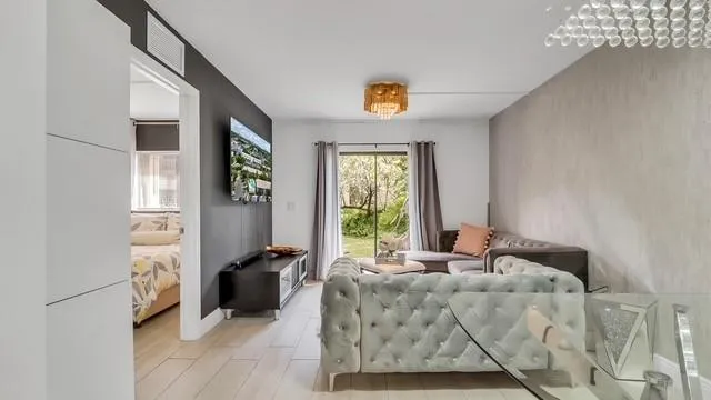 a living room with furniture and a window