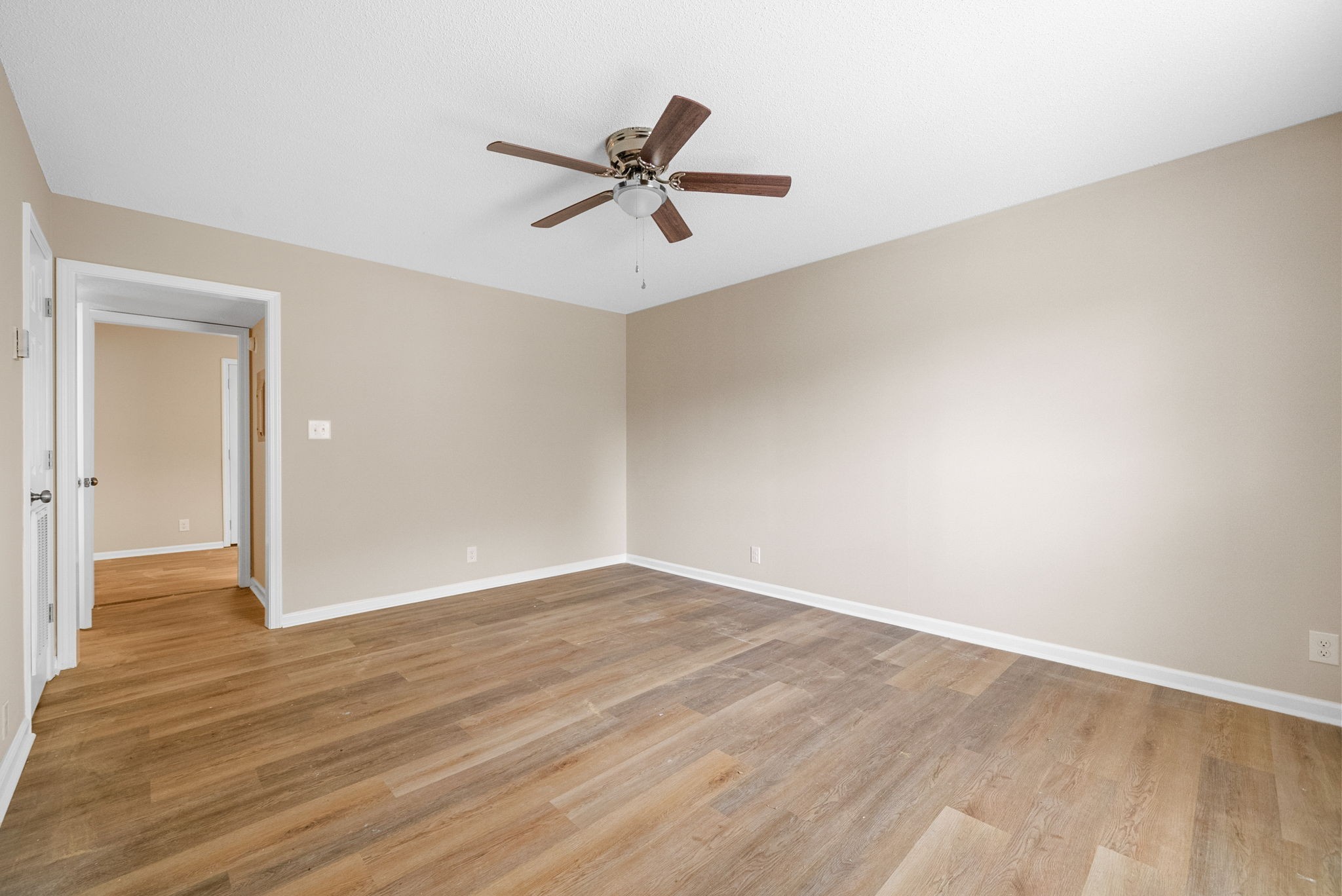 481 Martha Lane, Unit D Clarksville, TN 37043 - Photo 4 of 20 an empty room with wooden floor and windows