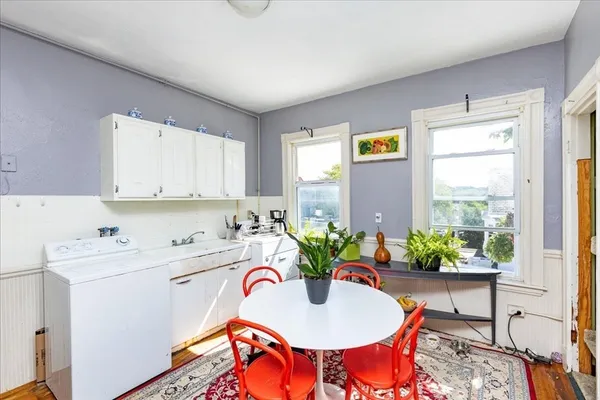 a living room with a sink and a window