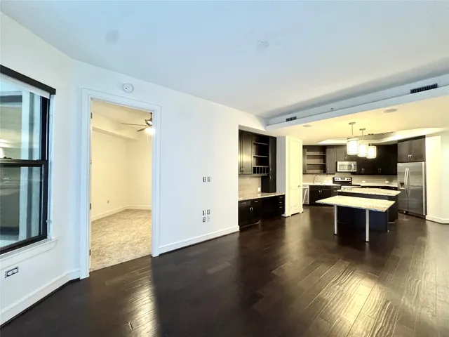 en view of empty room with a ceiling fan