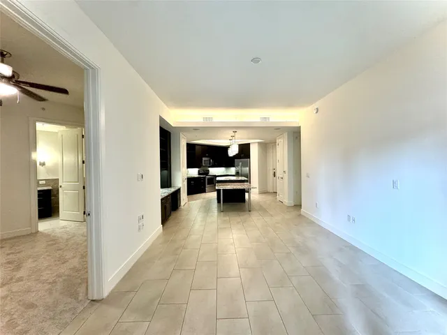a view of a livingroom with furniture and an entryway