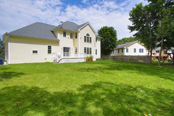 30 Cormier Road Burlington, MA 01803 - Photo 11 of 12 a front view of a house with a yard and trees