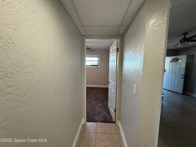 a bathroom with a granite countertop sink and mirror