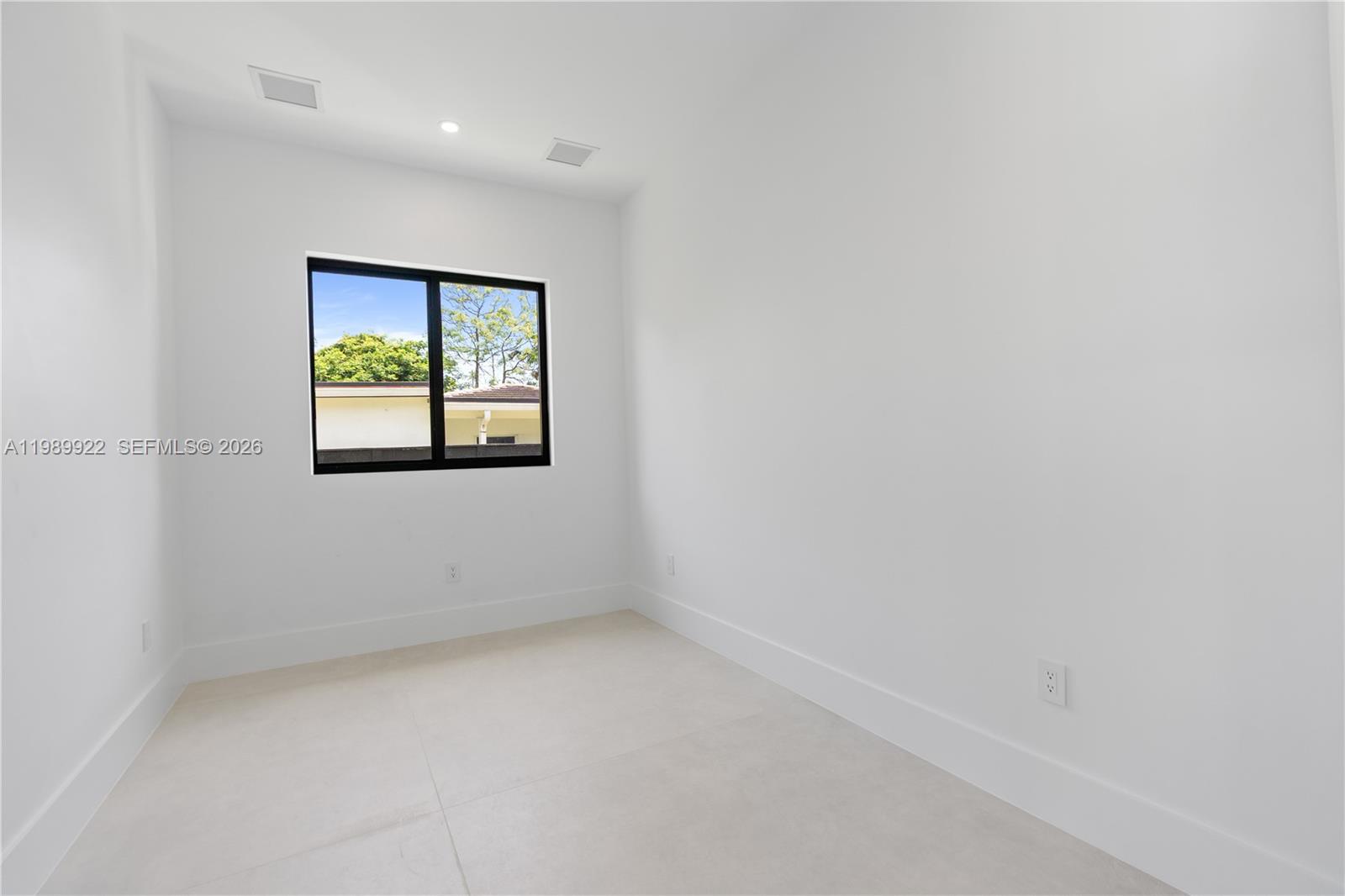 6221 Southwest 60th Street South Miami, FL 33143 - Photo 11 of 42 an empty room with windows