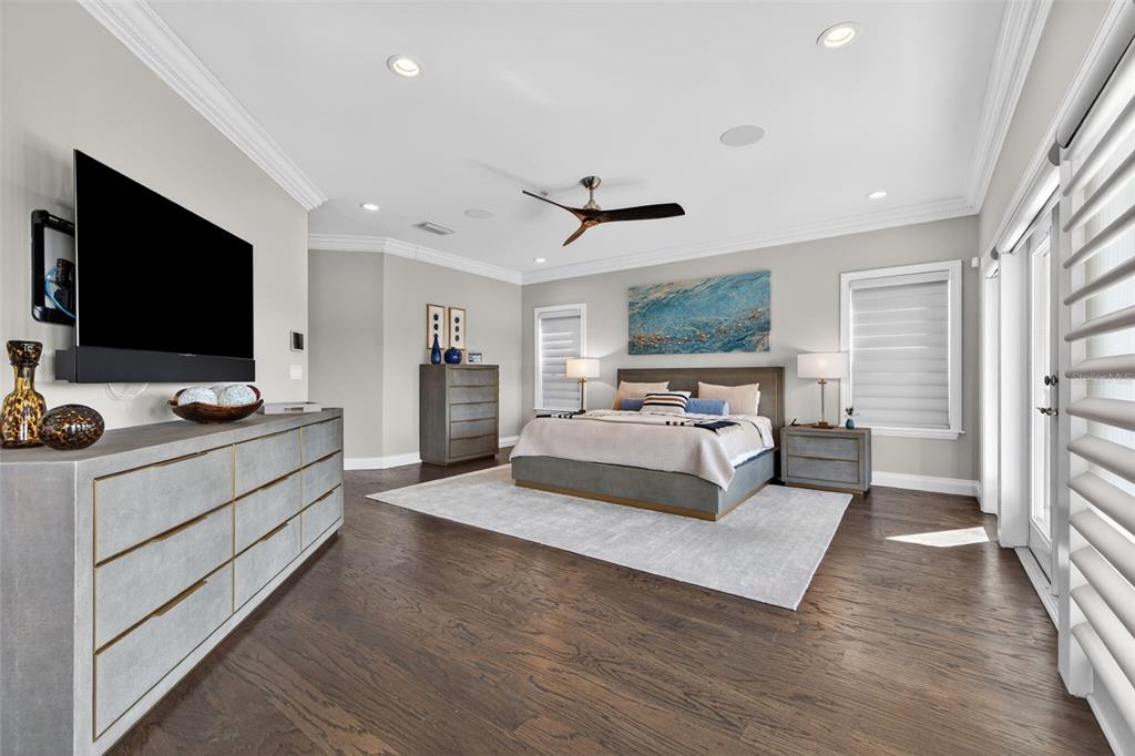 1009 Royal Pass Road Tampa, FL 33602 - Photo 40 of 74 a spacious bedroom with a bed and a flat screen tv