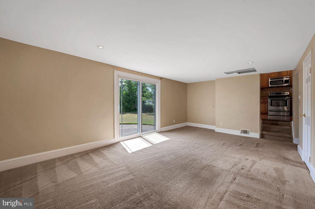 9731 Glenhope Road Philadelphia, PA 19115 - Photo 14 of 36 a view of an empty room with a window