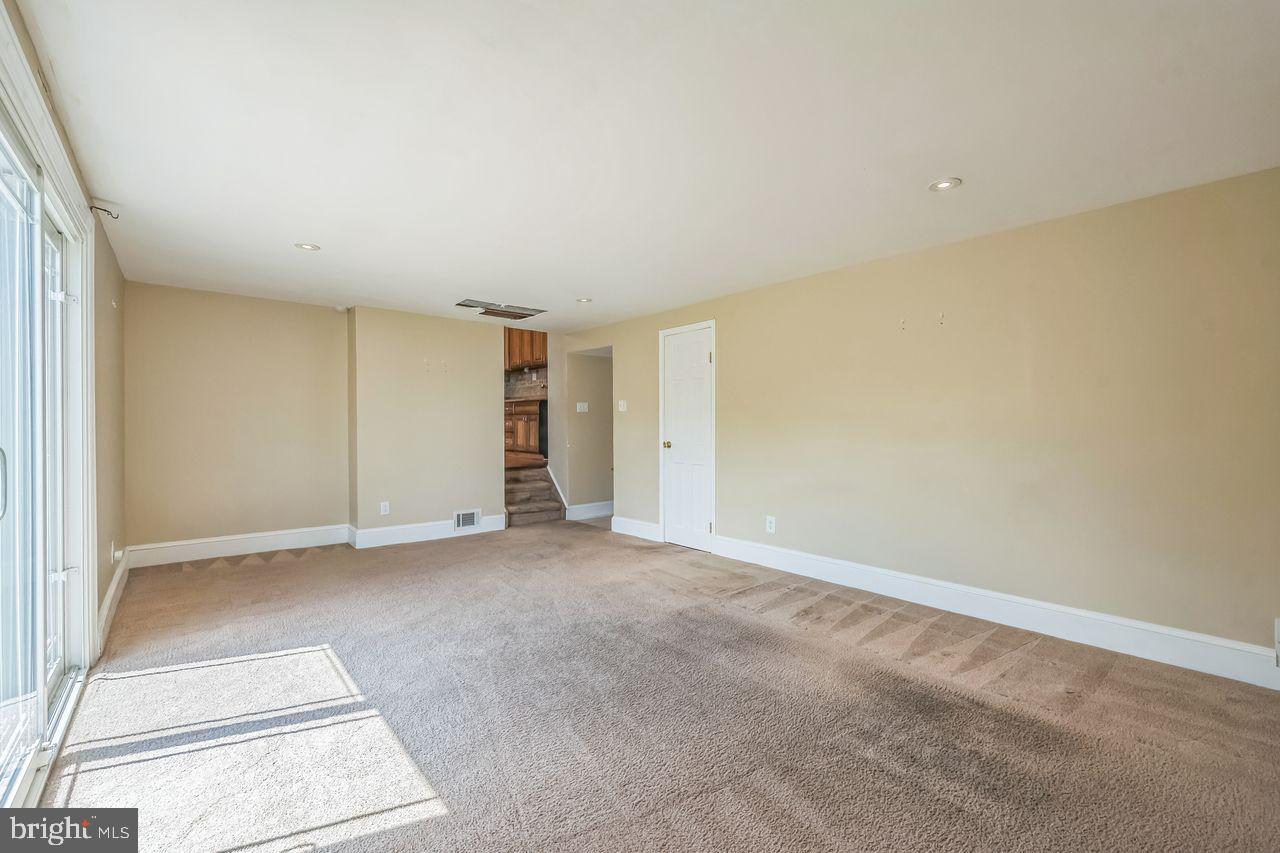 9731 Glenhope Road Philadelphia, PA 19115 - Photo 16 of 36 an empty room with a natural light