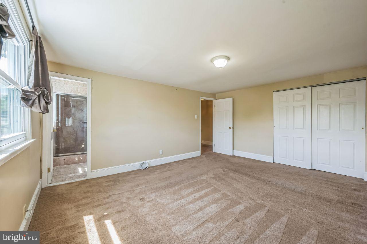 9731 Glenhope Road Philadelphia, PA 19115 - Photo 20 of 36 a view of an empty room and a window