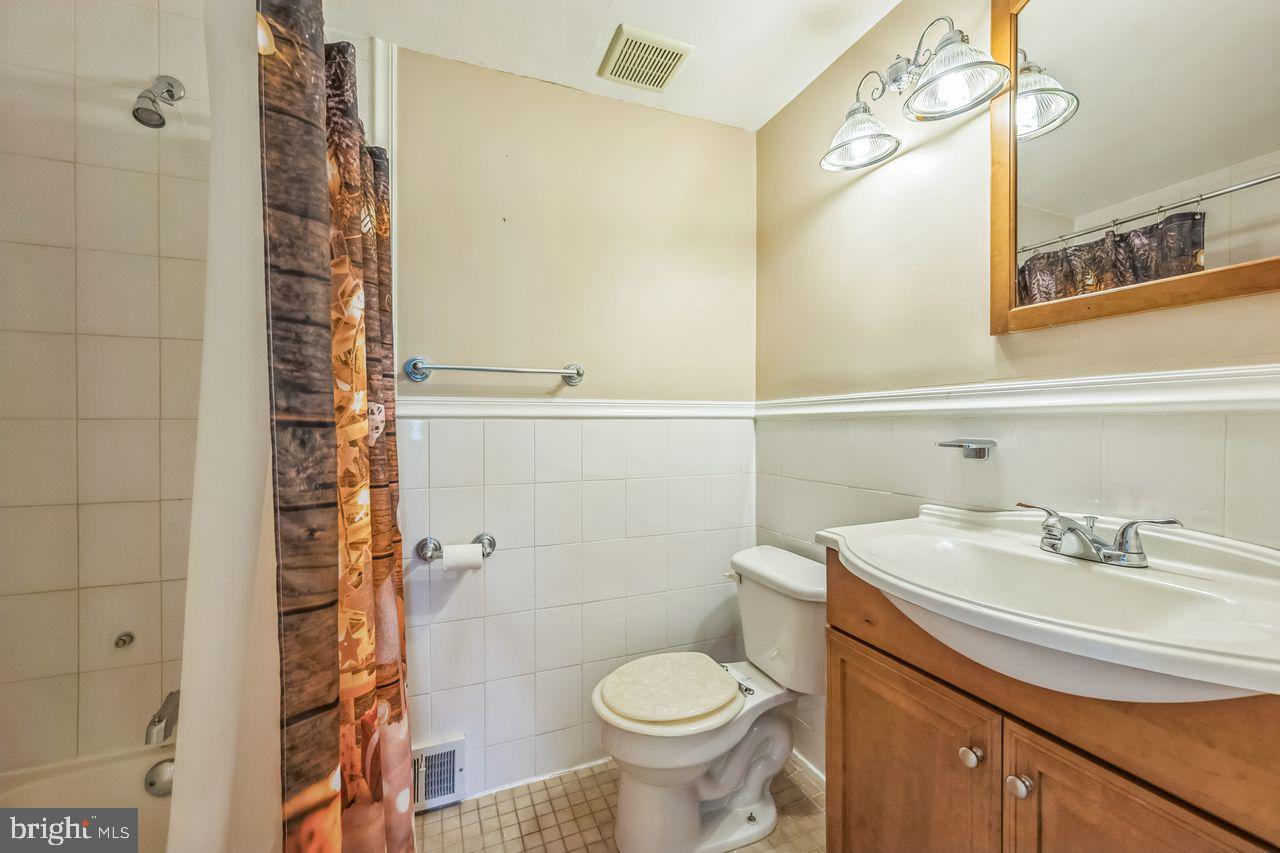 9731 Glenhope Road Philadelphia, PA 19115 - Photo 21 of 36 a bathroom with a sink toilet and shower