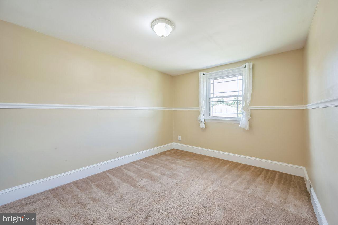 9731 Glenhope Road Philadelphia, PA 19115 - Photo 23 of 36 an empty room with a window
