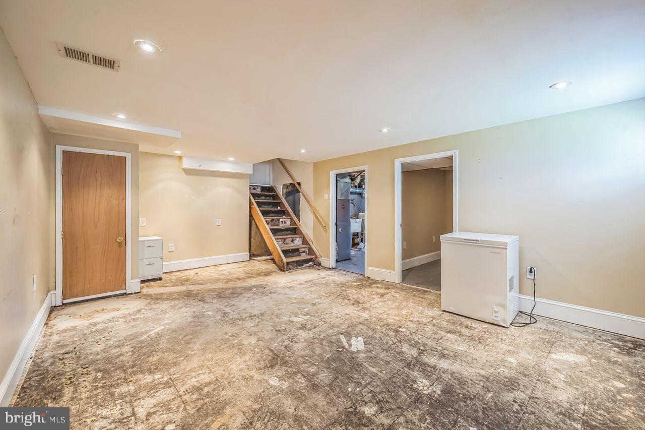9731 Glenhope Road Philadelphia, PA 19115 - Photo 30 of 36 a view of a livingroom with a staircase