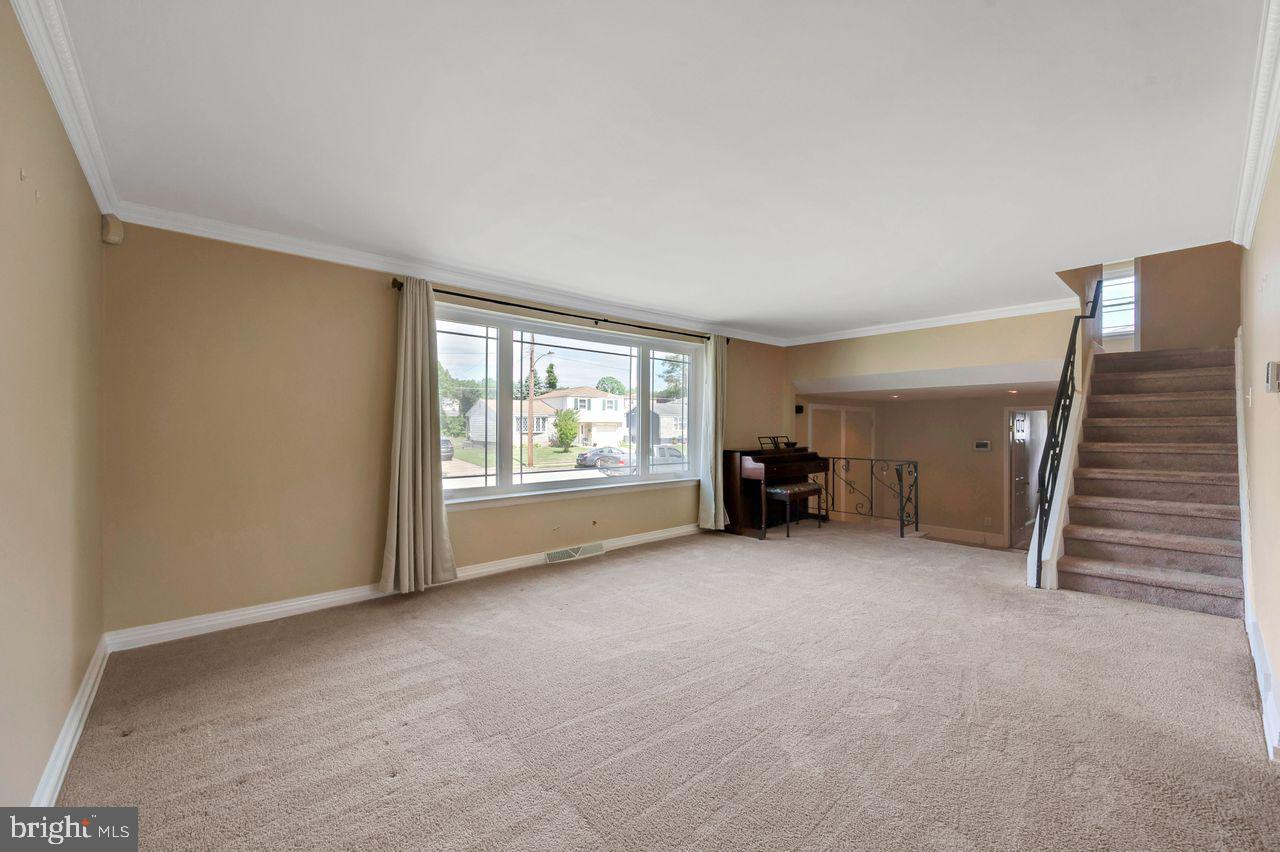 9731 Glenhope Road Philadelphia, PA 19115 - Photo 4 of 36 a view of empty room with furniture and staircase