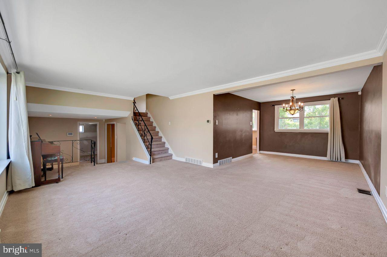 9731 Glenhope Road Philadelphia, PA 19115 - Photo 5 of 36 a view of an empty room with a window and fire place