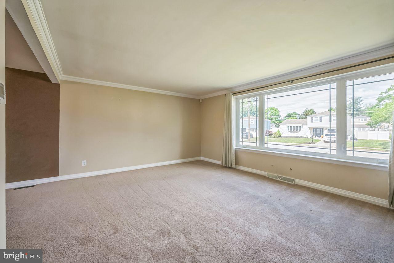 9731 Glenhope Road Philadelphia, PA 19115 - Photo 8 of 36 a view of an empty room with a window