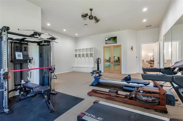 a room with gym equipment and a window