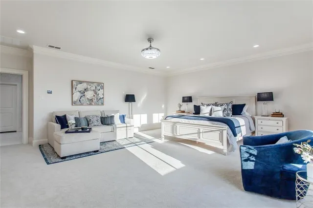a bedroom with a bed and glass window